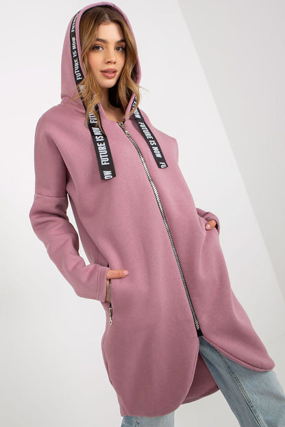 A women's sweatshirt with an extended cut, long sleeves, and a hood. Features a zip-up front and zippered slip pockets on the sides for added functionality.






