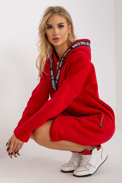 A women's sweatshirt with an extended cut, long sleeves, and a hood. Features a zip-up front and zippered slip pockets on the sides for added functionality.






