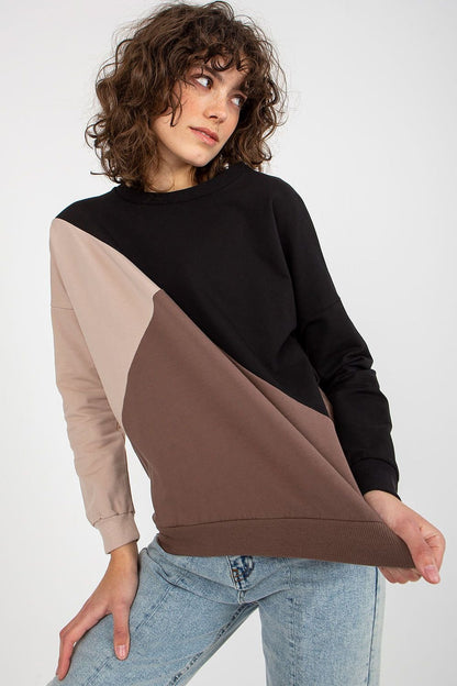 A women's sweatshirt featuring long sleeves and a round neckline, crafted from a stylish combination of three different fabric colors for a modern and eye-catching design.






