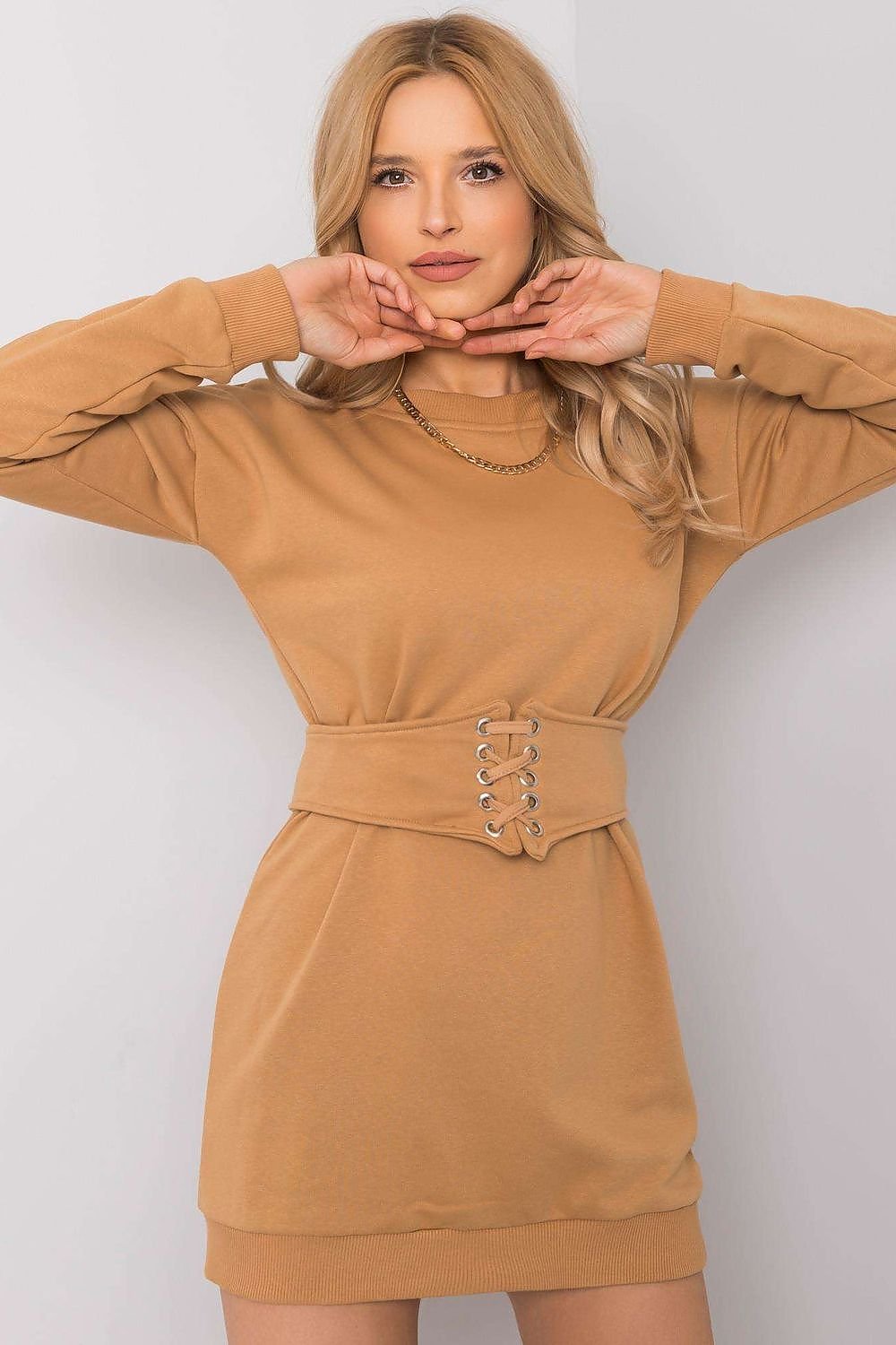 Mini dress with long sleeves, a round neckline, and a matching belt, offering a cohesive and fashionable tracksuit-inspired style.






