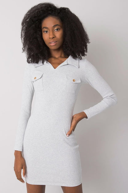 Formally styled Daydress made from ribbed material, featuring a pencil cut, long sleeves, and a heart-shaped neckline, offering a refined and elegant look.






