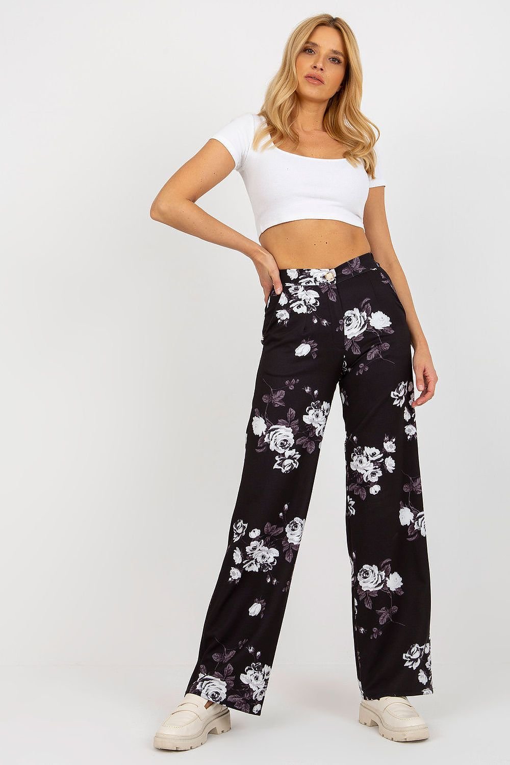 Elegant wide-leg pants with a high waist, featuring a zipper and button closure, and slip pockets on the sides. Perfect for pairing with a jacket or wearing on their own for a sophisticated look.






