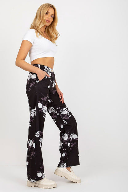 Elegant wide-leg pants with a high waist, featuring a zipper and button closure, and slip pockets on the sides. Perfect for pairing with a jacket or wearing on their own for a sophisticated look.






