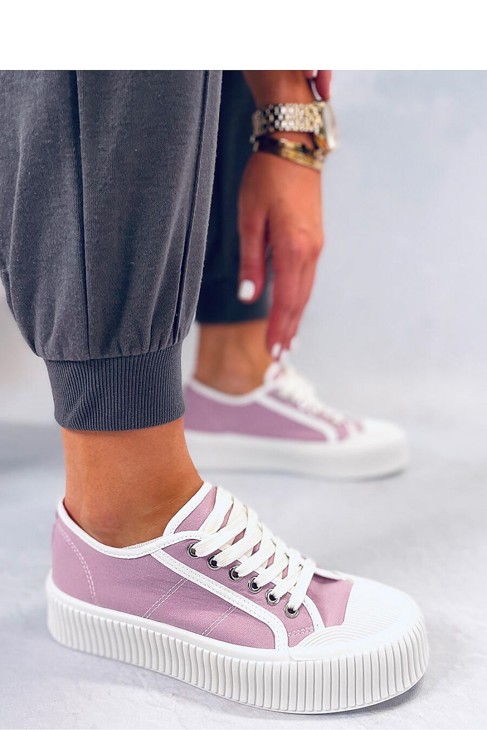 Stylish violet women's platform sneakers featuring a high sole to enhance your silhouette. Made from fabric for both outer and inner materials, these sneakers offer both fashion and comfort for everyday wear. Perfect for adding a pop of color to your casual outfits.






