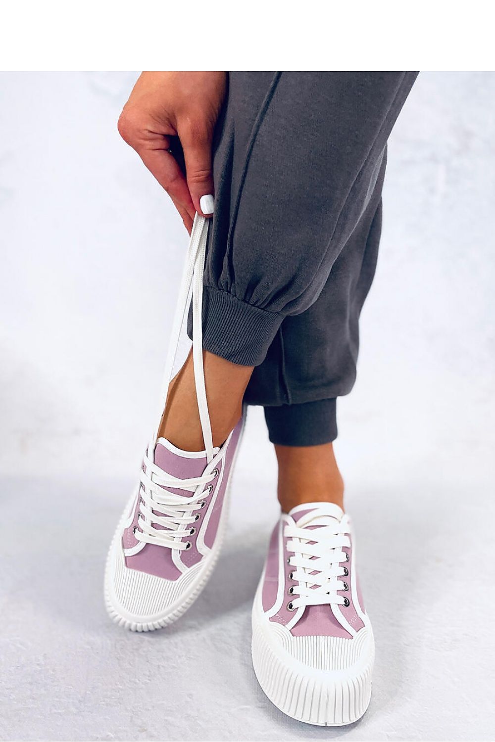 Stylish violet women's platform sneakers featuring a high sole to enhance your silhouette. Made from fabric for both outer and inner materials, these sneakers offer both fashion and comfort for everyday wear. Perfect for adding a pop of color to your casual outfits.






