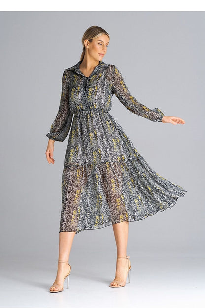 A midi-length, flared, lined dress with long crinkled sleeves with elastic, a collared neckline, a button-down waist, and a wide ruffle at the bottom for a feminine touch.






