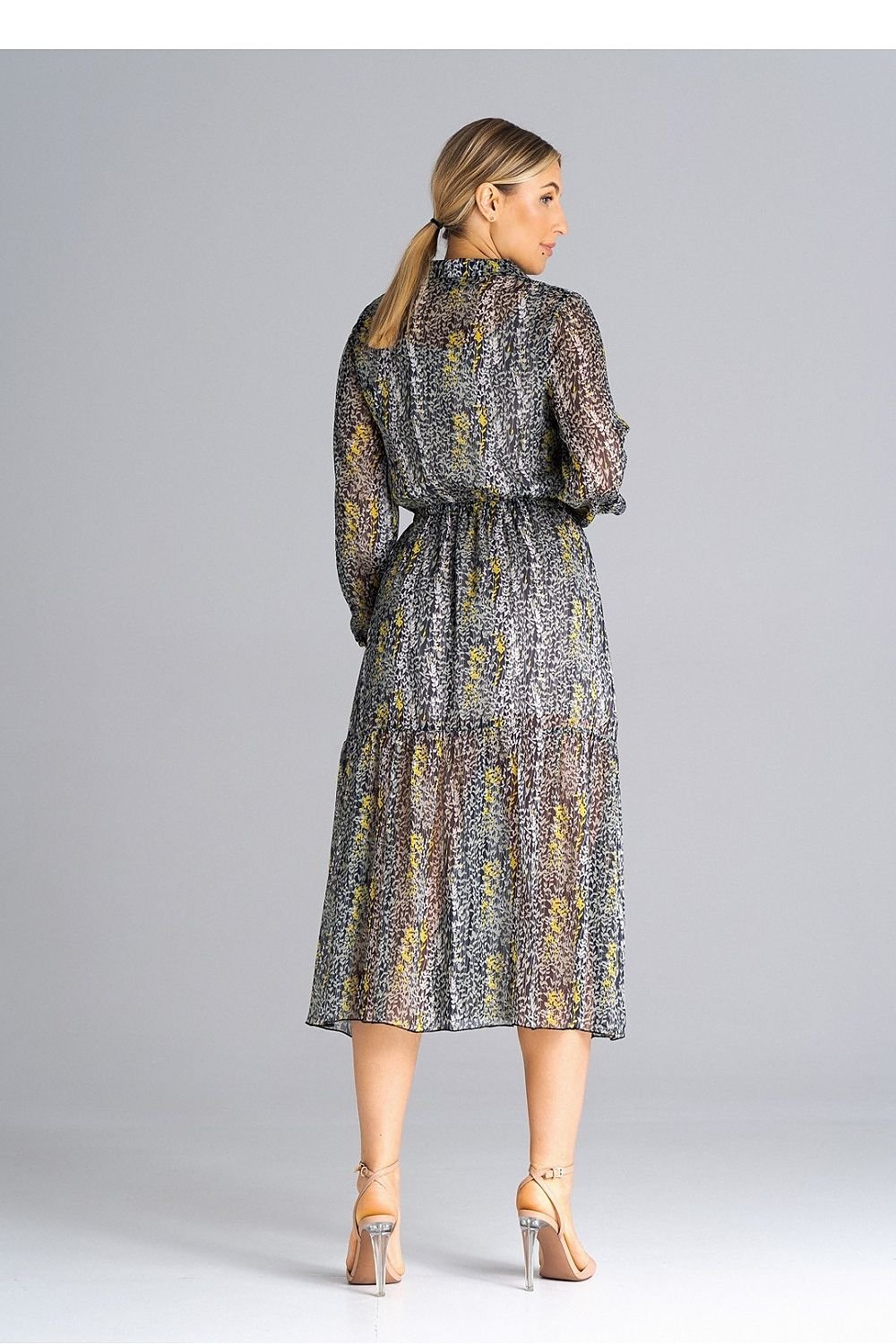 A midi-length, flared, lined dress with long crinkled sleeves with elastic, a collared neckline, a button-down waist, and a wide ruffle at the bottom for a feminine touch.






