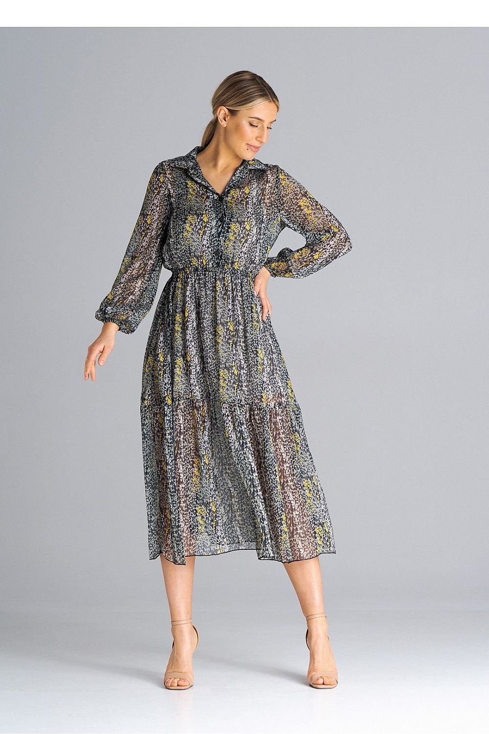 A midi-length, flared, lined dress with long crinkled sleeves with elastic, a collared neckline, a button-down waist, and a wide ruffle at the bottom for a feminine touch.






