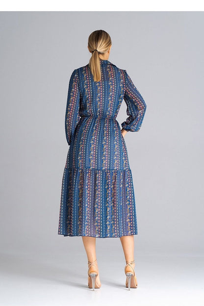 A midi-length, flared, lined dress with long crinkled sleeves with elastic, a collared neckline, a button-down waist, and a wide ruffle at the bottom for a feminine touch.






