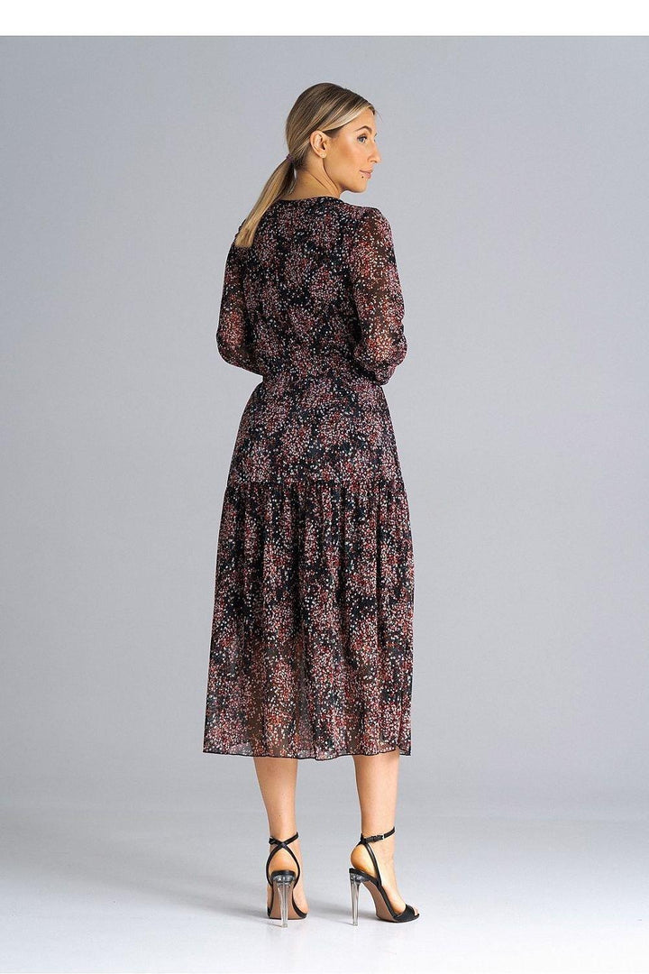 This elegant midi dress features a flattering flared cut, long sleeves, and a set-in neckline, offering a timeless and sophisticated look. The pleated waist enhances the silhouette, creating a feminine shape, while the lining ensures comfort and a smooth fit. Designed to be worn over the head, this dress combines ease with style, making it a perfect choice for both casual and semi-formal occasions.






