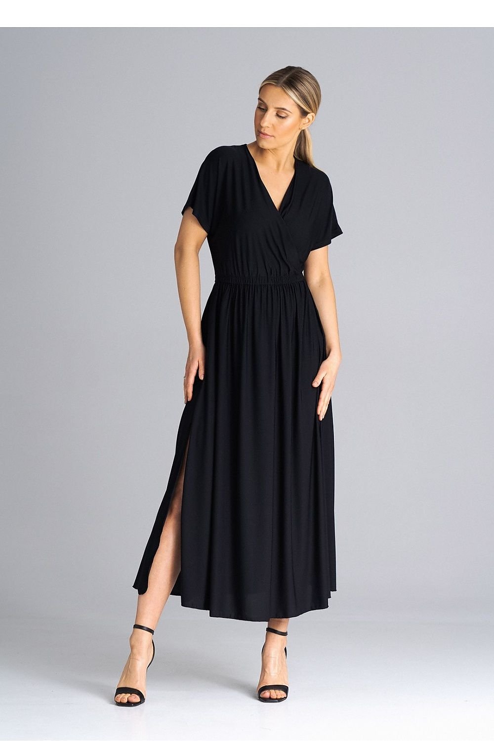 A stylish dress featuring an overlapping neckline, short draped sleeves, an elastic waistband, and asymmetrical side slits for added elegance.






