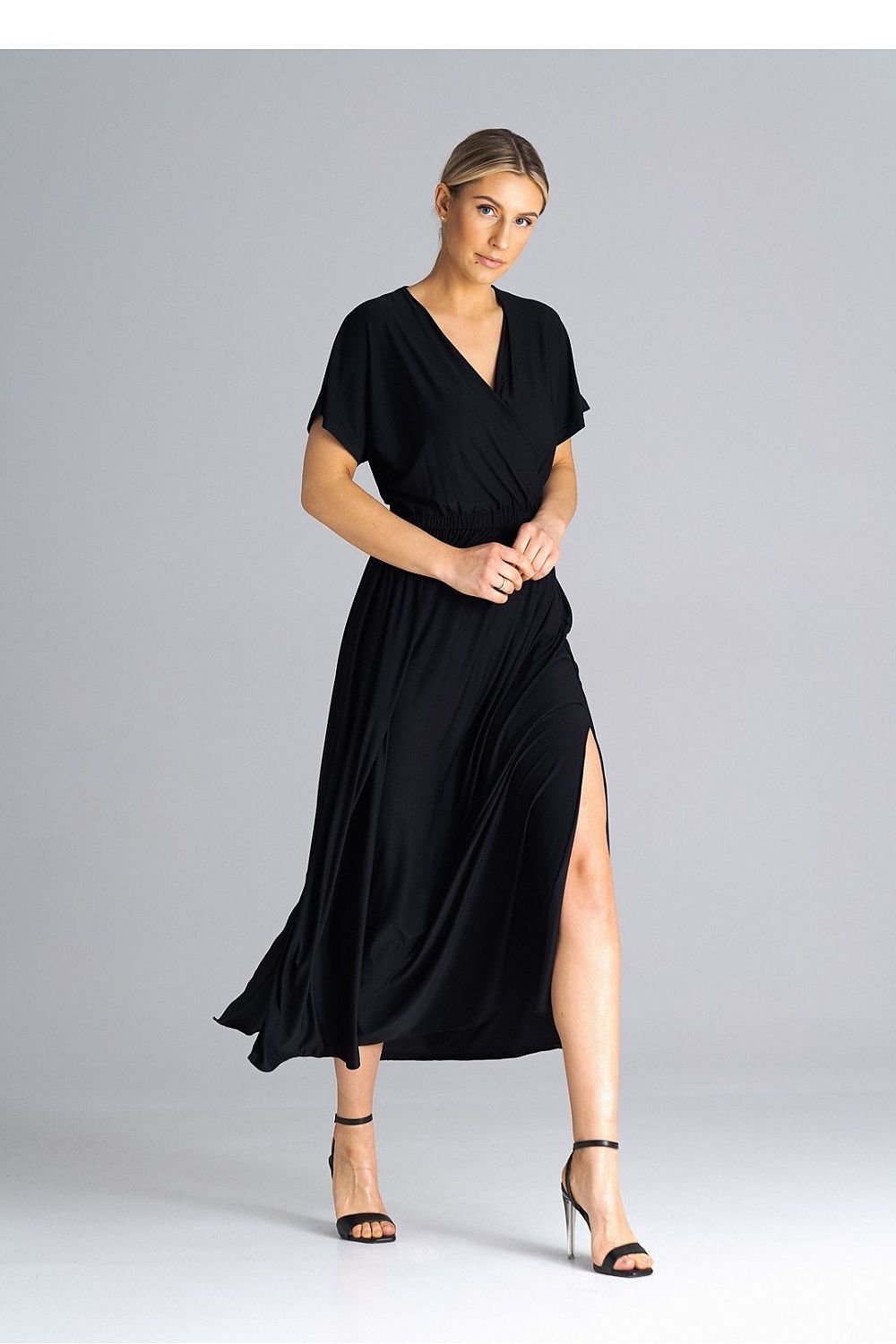 A stylish dress featuring an overlapping neckline, short draped sleeves, an elastic waistband, and asymmetrical side slits for added elegance.






