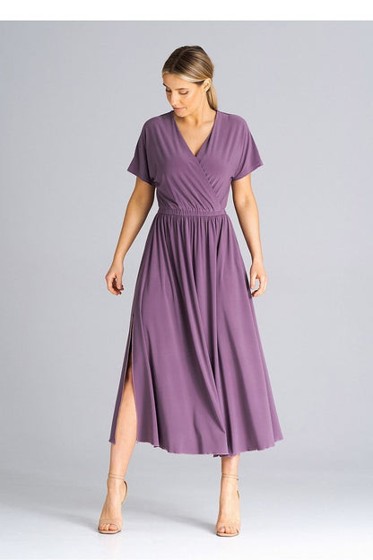 A stylish dress featuring an overlapping neckline, short draped sleeves, an elastic waistband, and asymmetrical side slits for added elegance.






