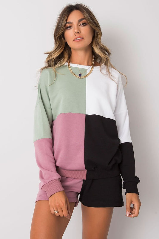 A stylish casual set featuring a colorblock sweatshirt with long sleeves and ribbed cuffs, paired with matching shorts. The sweatshirt showcases a modern design with pastel and neutral tones, while the shorts offer a relaxed fit, perfect for lounging or casual outings.






