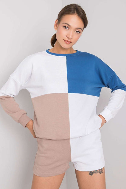 A stylish casual set featuring a colorblock sweatshirt with long sleeves and ribbed cuffs, paired with matching shorts. The sweatshirt showcases a modern design with pastel and neutral tones, while the shorts offer a relaxed fit, perfect for lounging or casual outings.






