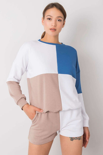 A stylish casual set featuring a colorblock sweatshirt with long sleeves and ribbed cuffs, paired with matching shorts. The sweatshirt showcases a modern design with pastel and neutral tones, while the shorts offer a relaxed fit, perfect for lounging or casual outings.






