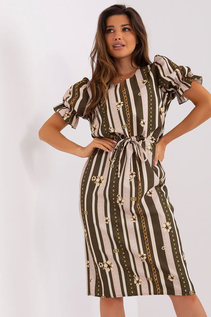 A chic dress featuring short sleeves with buffet-style cuffs and a decorative slit neckline. Tied at the waist for a flattering silhouette, this dress combines elegance and modern design for a stylish look.






