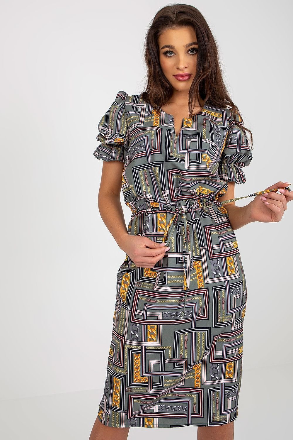 A chic dress featuring short sleeves with buffet-style cuffs and a decorative slit neckline. Tied at the waist for a flattering silhouette, this dress combines elegance and modern design for a stylish look.






