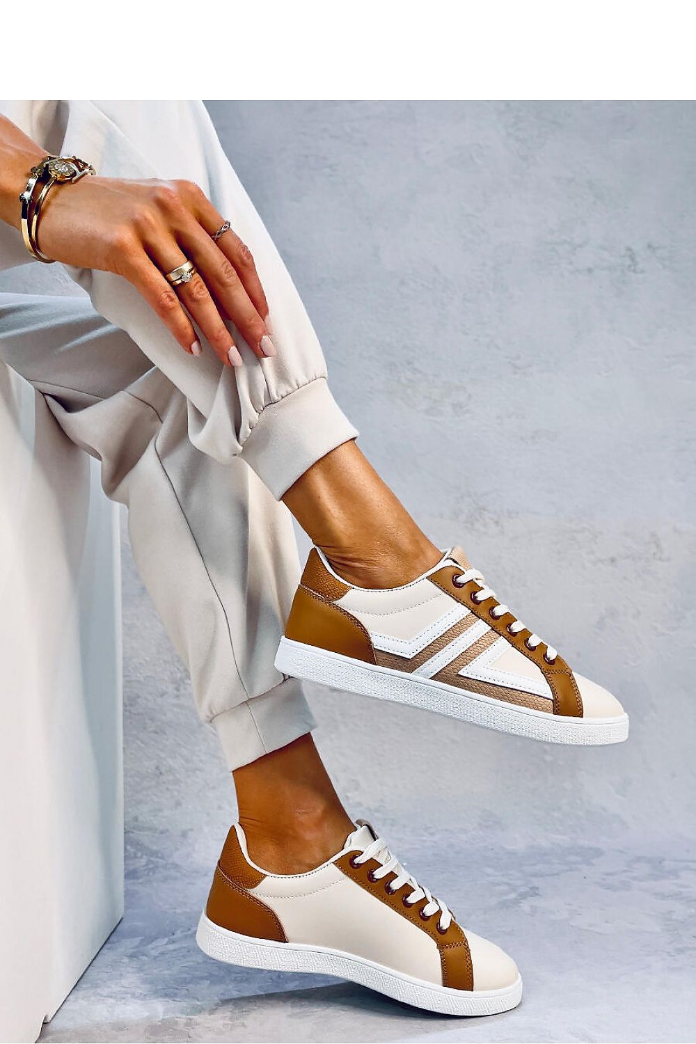 Eye-catching multicolored women's lace-up sneakers crafted from ecological leather. The fabric-lined interior ensures comfort, while the bold design makes these sneakers a standout choice for both style and ease.






