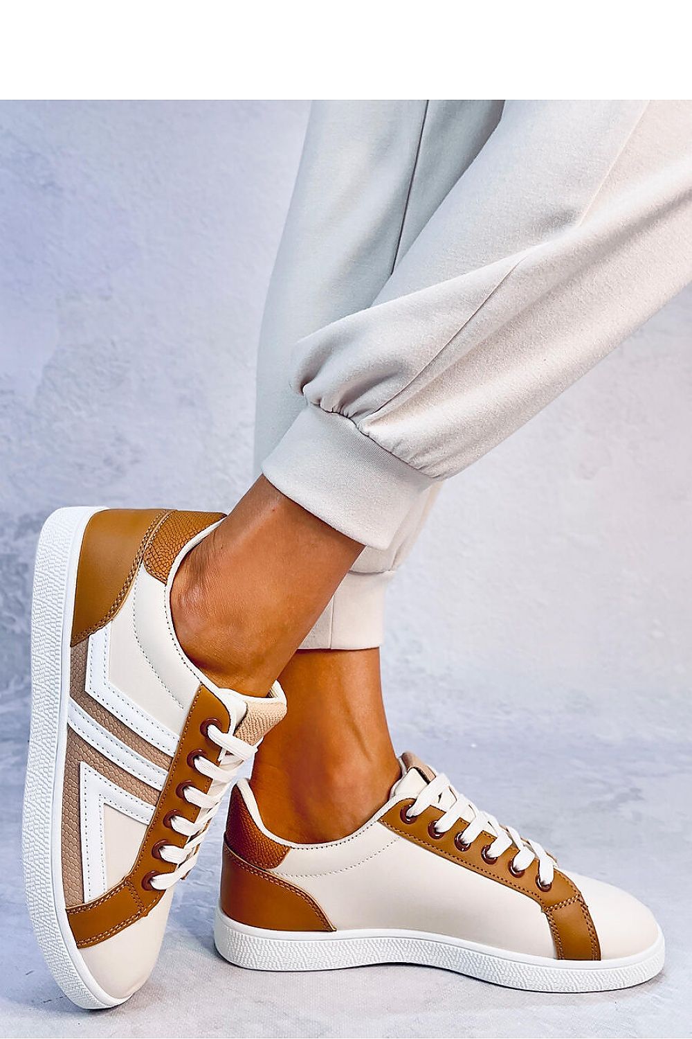 Eye-catching multicolored women's lace-up sneakers crafted from ecological leather. The fabric-lined interior ensures comfort, while the bold design makes these sneakers a standout choice for both style and ease.












