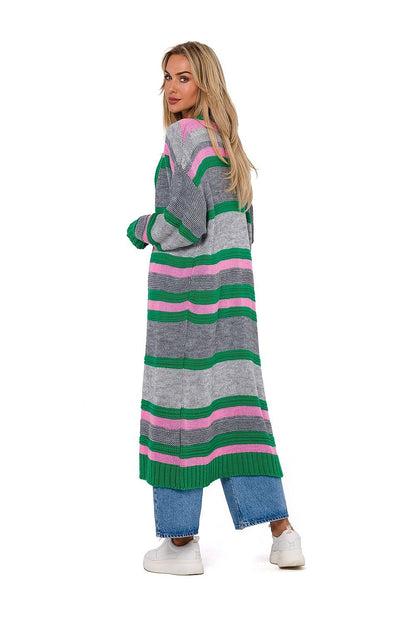  A vibrant long cardigan featuring a thick weave, unbuttoned design, and long sleeves. Designed and manufactured in Poland, this cardigan offers both style and comfort.