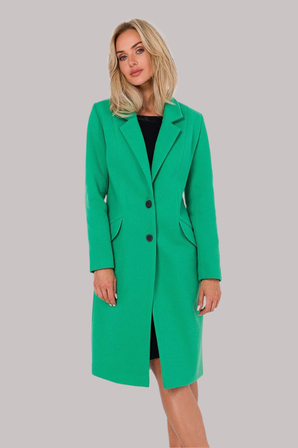 Classic fleece women's coat with padded collar, button closure, asymmetrical front pockets, and fully lined interior. Designed and sewn in Poland.






