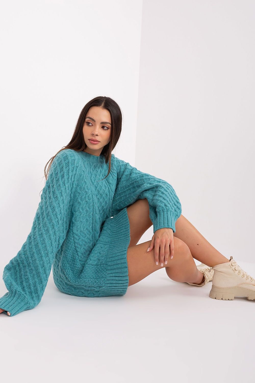 Comfortable oversized long sweater with a unique variegated fabric texture, made of soft acrylic for warmth, featuring long buff sleeves and a versatile design that can be worn as a short dress.






