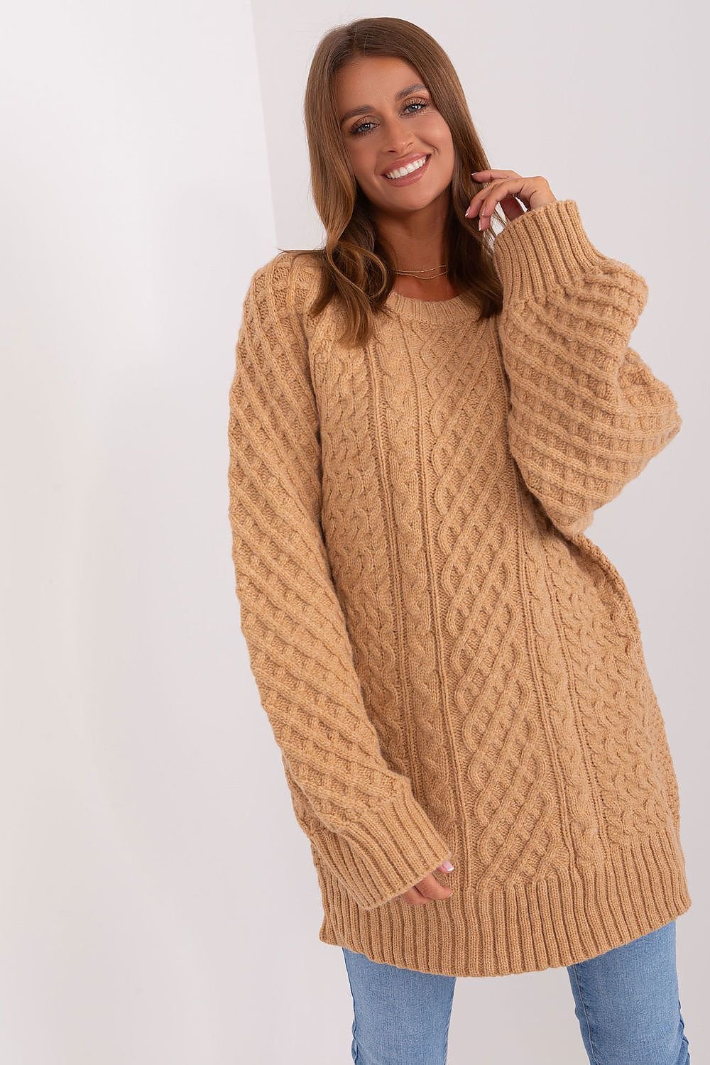 Comfortable oversized long sweater with a unique variegated fabric texture, made of soft acrylic for warmth, featuring long buff sleeves and a versatile design that can be worn as a short dress.






