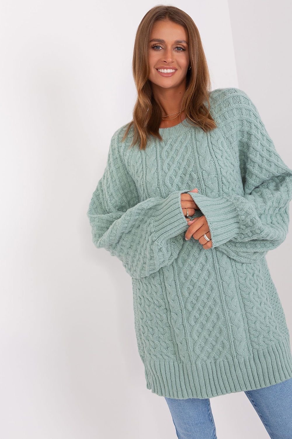 Comfortable oversized long sweater with a unique variegated fabric texture, made of soft acrylic for warmth, featuring long buff sleeves and a versatile design that can be worn as a short dress.






