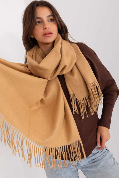 A cozy long scarf featuring decorative tassels, perfect for adding warmth and style to your winter wardrobe. Ideal for keeping you comfortable during colder months.






