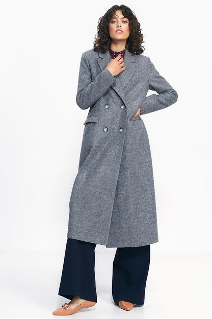 Oversized black double-breasted coat with an over-the-knee length, ideal for pairing with jeans or dresses.






