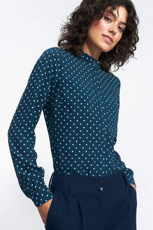 A classic button-down shirt with a simple cut, long sleeves finished with cuffs, and a stand-up collar featuring a charming pea pattern. Made from 100% viscose for comfort, it pairs perfectly with suit sets and is ideal for business styling.






