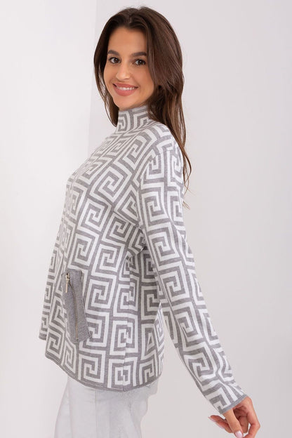 Fashionable women's sweater with long sleeves, a half turtleneck, and a geometric pattern, featuring zippered pockets, perfect for everyday wear and work during colder days.






