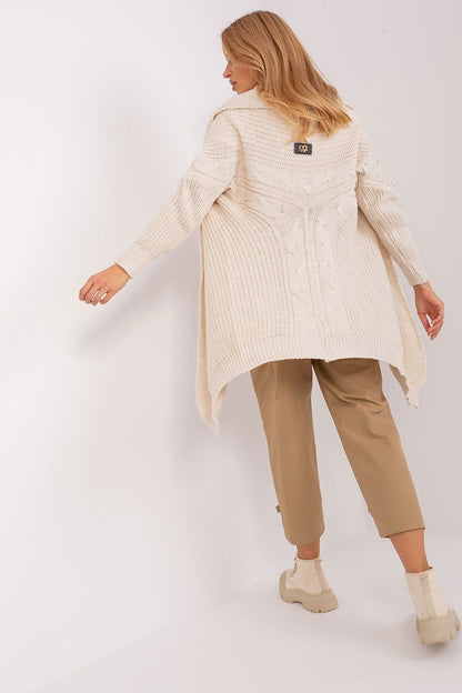  A comfortable and versatile cardigan made from soft acrylic, featuring long sleeves, a loose fit, and a smooth, uniform fabric texture. Its knee-length cut and casual style make it perfect for pairing with pants, dresses, or skirts, available in a variety of colors.