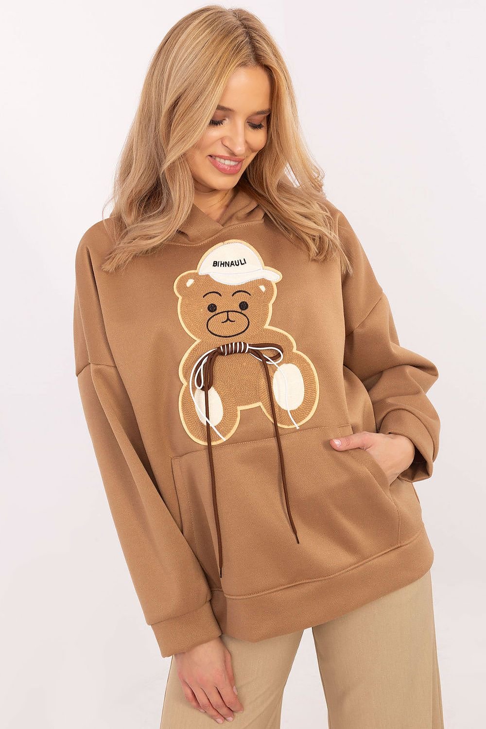 oversized sweatshirt featuring a playful teddy bear graphic